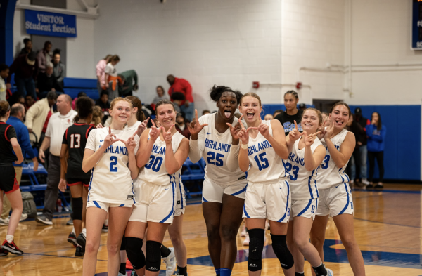 Kaylee Mills (11), Avery Barber (11), Ty berry (12), Katie Bucher (11) Maddie Barlow (11) and Isa Neufarth celebrate after a tough fought win against Holy Cross.